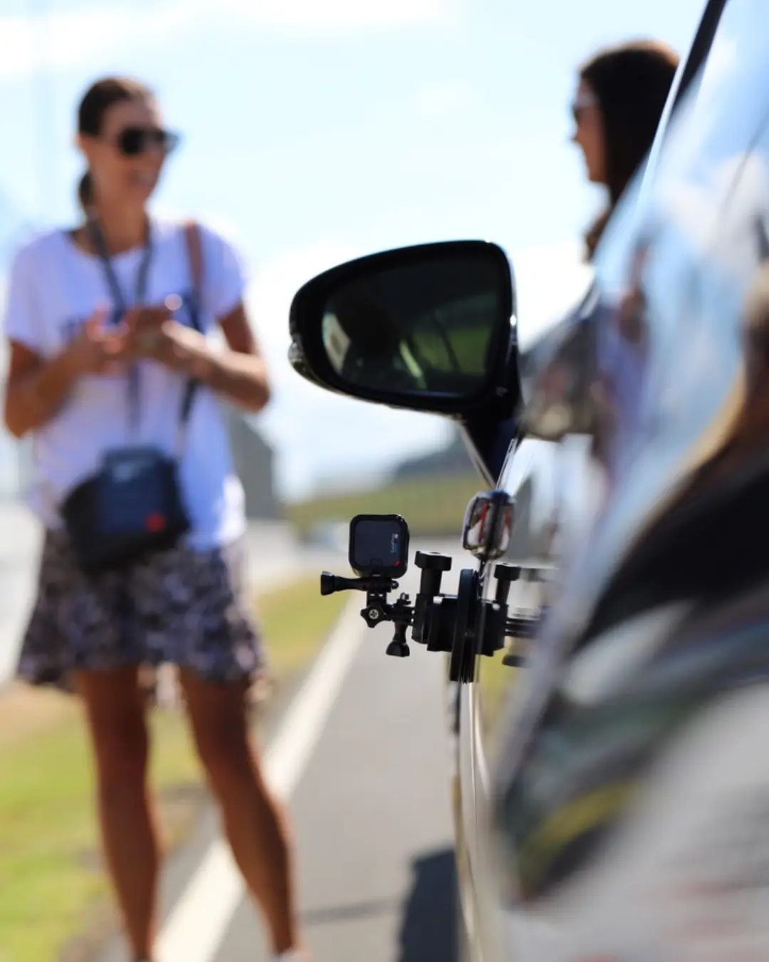 Action shot of camera attached to side of car for videography Total Digital Marketing orbit social